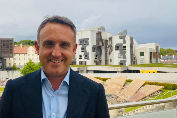 Alex Cole-Hamilton in front of the Scottish Parliament