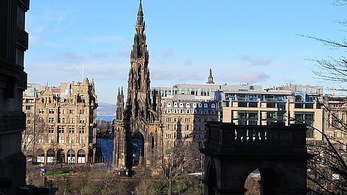 The Walter Scott Monument, a large spire, with Princes Street in the background.