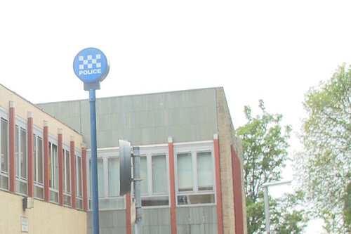 Police Station with a flagpole sign