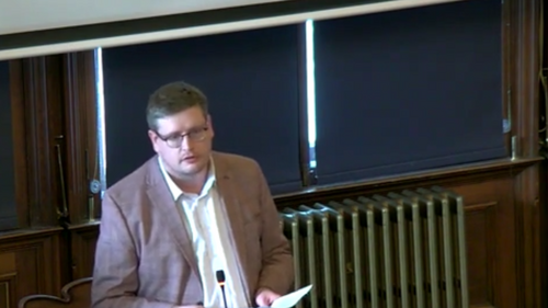 Euan Davidson standing in a meeting room