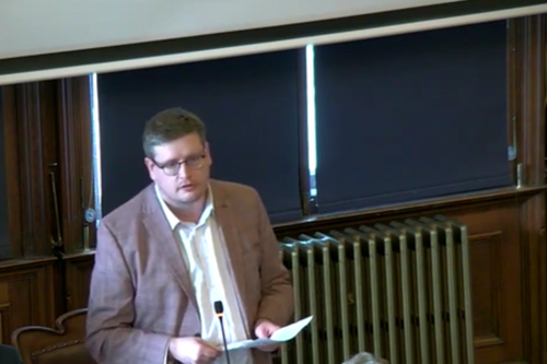 Euan Davidson standing in a meeting room