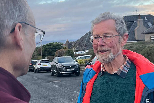 Peter Nicholson speaks with a local resident in Fairmilehead