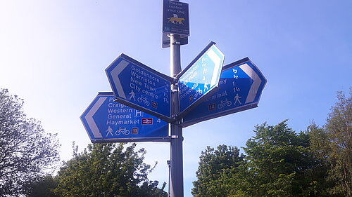 Signs on the North Edinburgh Path Network pointing to Goldenacre, Warriston, City Centre and Bonnington 